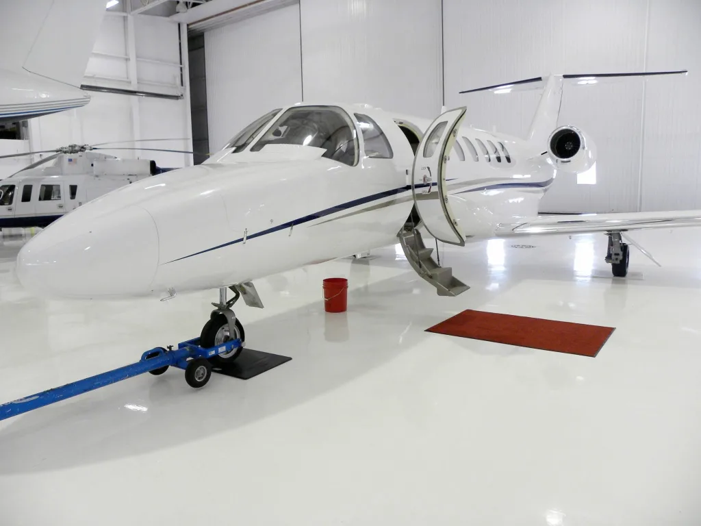 Epoxy Flooring Colorado Springs - V8 Airplane Hangar Floor Coating White